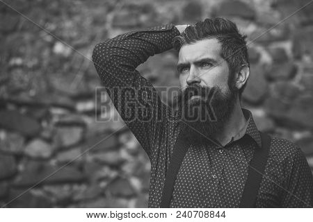 Closeup View Of One Handsome Senior Man With Black Hair And Long Lush Beard In Blue Shirt And Purple