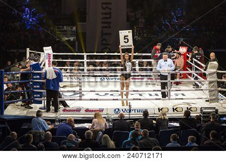 Brovary. Ukraine, 14.11.2015 Ring Girl Stands Inside The Boxing Ring And Holds A Plate With The Insc