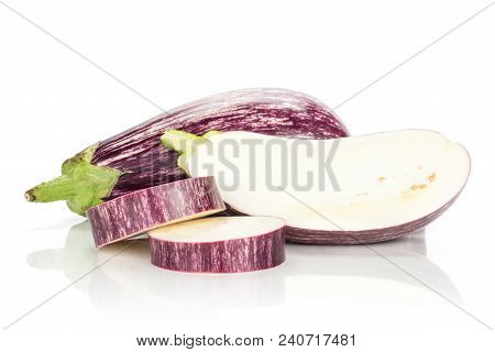 One Striped Purple Eggplant With A Half And Two Ring Slices Isolated On White Background