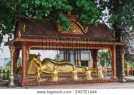 Buddha Lying And Monks In The Buddhist Religious Ensemble Wat Kraom In The Vicinity Of Sihanoukville