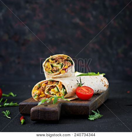 Burritos Wraps With Beef And Vegetables On  Black Background. Beef Burrito, Mexican Food.