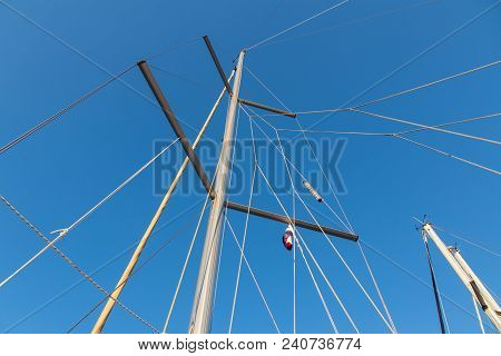 Rigging Mast And Halyards Of A Sailing Boat Under A Beautiful Blue Sky