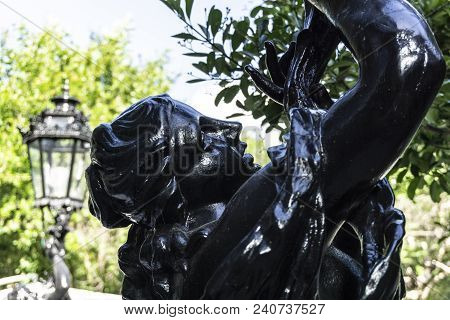 Carved Steel Statue Of Black Color With The Face Of A Venus Woman In Lisbon