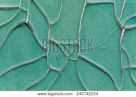 Old Green Paint With Fissures As Background.