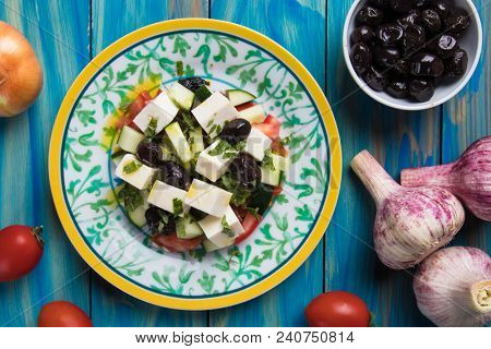 Greek salad with feta cheese cubes and fresk vegetables