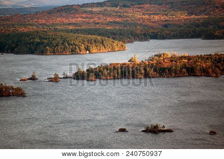 Mountains And Squam Lake In New Hampshire At Fall Time