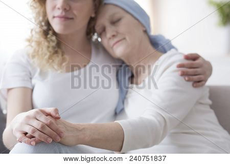 Daughter Supporting Sick Mother