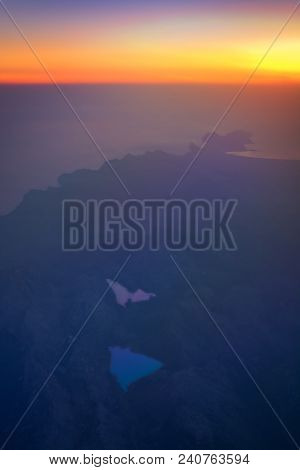 Flight Image At Sunrise Over Tramuntana Mountains And The Cuber Reservoir Filled With Rain Water