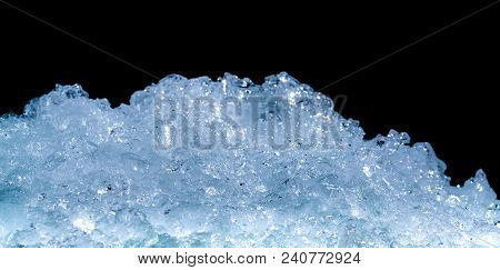 Pile Of Crushed Ice Cubes On Dark Background With Copy Space. Crushed Ice Cubes Foreground For Bever