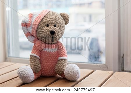 Teddybear Toy Knitted In The Technique Of Knitting Amigurumi.