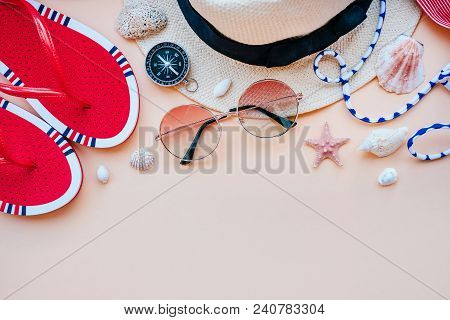 Summer Fashion Flatlay With Gradient Round Sunglasses, Straw Hat, Flats And Red Striped Bikini Top. 