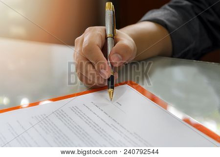 Close Up Of Business Man Signing Contract Making A Deal, Business Contract Details. Businessman Sign