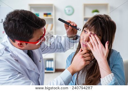 Doctor examining patients eye in hospital