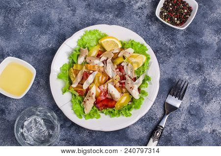 Fish Fillet With Raw Vegetables And Lemon In A Dish On The Table. Selective Focus.