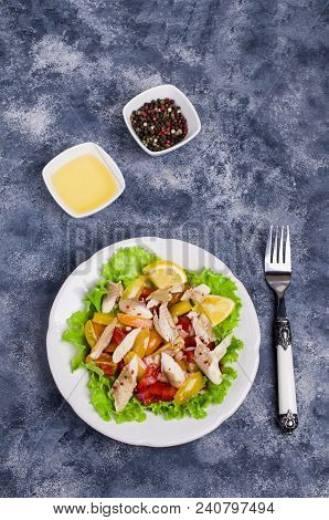 Fish Fillet With Raw Vegetables And Lemon In A Dish On The Table. Selective Focus.