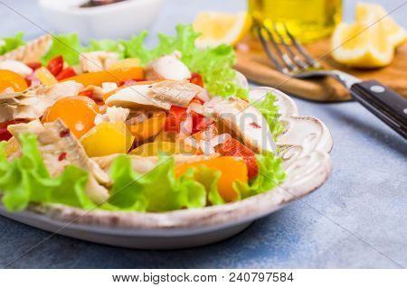 Fish Fillet With Raw Vegetables And Lemon In A Dish On The Table. Selective Focus.