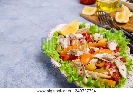 Fish Fillet With Raw Vegetables And Lemon In A Dish On The Table. Selective Focus.