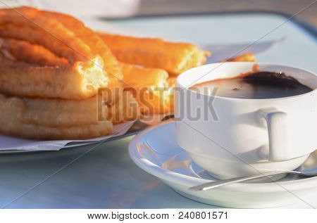 Typical Spanish Snack Churros Are Deep-fried Pastries  And Served With Hot Chocolate Everywhere In S