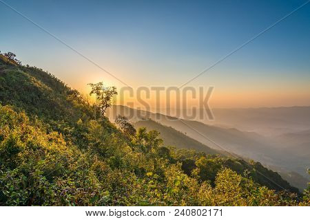 View Of Phu Chi Dao In Sunset Time With Mountain Layers In Chiang Rai, Thailand.