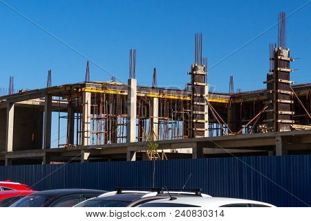 Lots Of Tower Construction Site With Cranes And Building With Blue Sky Background