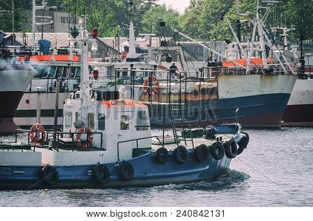 Fishing Port - Fishing Boats At The Wharf And Sailing Pilot Boat