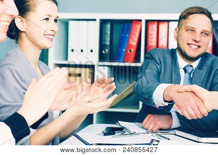 Male Handshake In Office. Serious Business And Partnership Concept. Partners Made Deal, Sealed With 