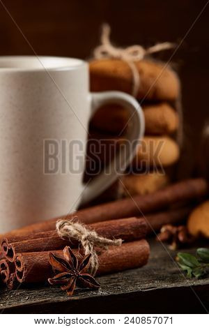 Traditional Christmas Tea Concept With A Cup Of Hot Tea, A Large Set Of Cookies On A Homespun Napkin