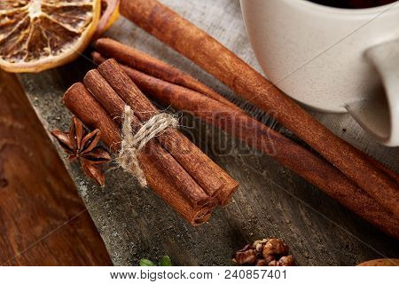 Traditional Christmas Tea Concept With A Cup Of Hot Tea, A Large Set Of Cookies On A Homespun Napkin