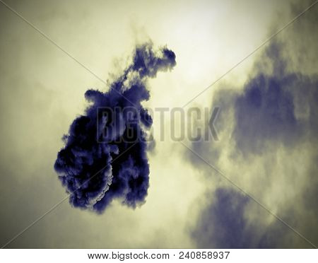 Black Cloud After The Explosion Of The Rocket In The Sky With Vintage Old Effect