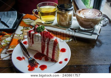 Strawberry Crape Cake On Wood Table In Coffee Shop , Dessert Tasy Cake