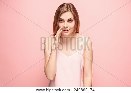 Secret, Gossip Concept. Young Woman Whispering A Secret Behind Her Hand. Business Woman Isolated On 