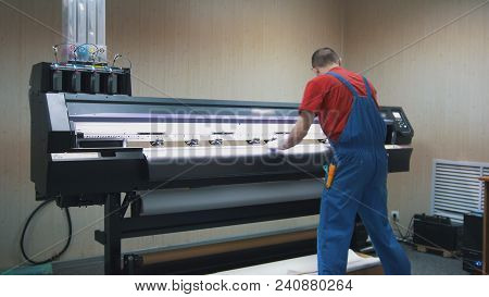 Male Worker In Typography Working On The Printing Maschine, Close Up