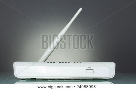 Wi-fi Router Device With Secure Wireless Setup Wps, On Gray Background