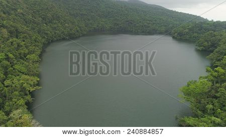 Aerial View Of Lake Bulusan In The Mountains With Green Rain Forest. Lake Hidden In The Jungle Mount