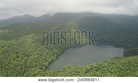 Aerial View Of Lake Bulusan In The Mountains With Green Rain Forest. Lake Hidden In The Jungle Mount
