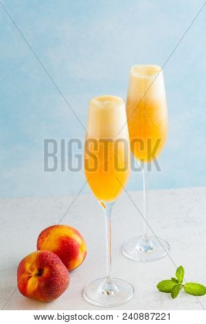 Two Glasses Of Champagne With A Cocktail Of Bellini And Fresh Pe