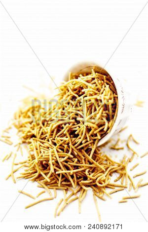 Popular Indian & Gujarati Dish Aloo Sev Or Potato Sev Or Mint Flavored Sev In A Bowl Isolated On Whi
