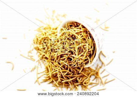 Popular Indian & Gujarati Dish Aloo Sev Or Potato Sev Or Mint Flavored Sev In A Bowl Isolated On Whi