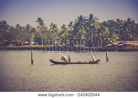 A Fishermen In A Traditional Boat In Kerala, India