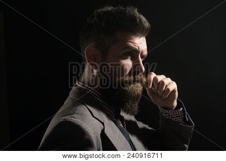 Vintage, Retro Style - Elegant Fashion Man With Beard And Mustache In Gray Suit Twisting By Hand Mus