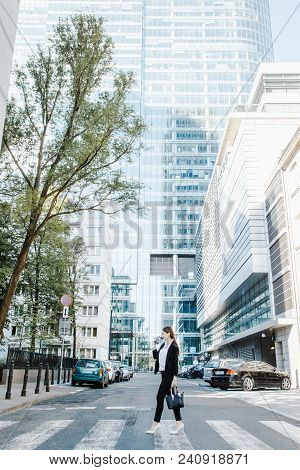 A Business Woman In A Big City Speaks By Phone. A Working Woman Spoke On Her Cell Phone On The Stree