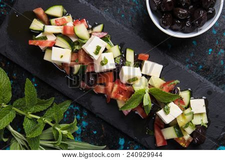 Greek salad with feta cheese cubes and fresk vegetables
