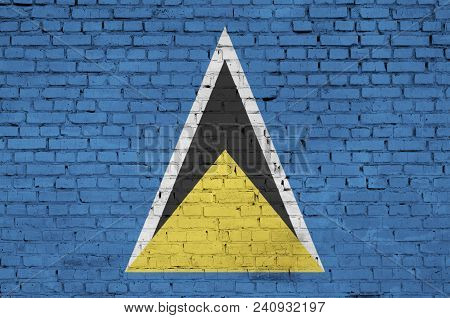 Saint Lucia Flag Is Painted Onto An Old Brick Wall