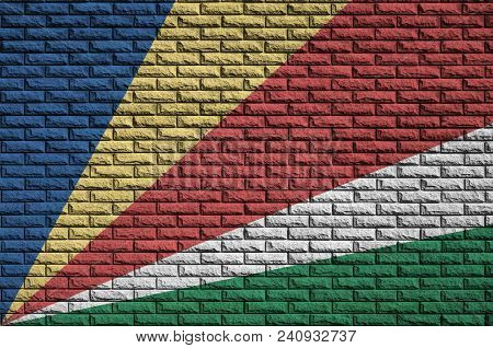 Seychelles Flag Is Painted Onto An Old Brick Wall