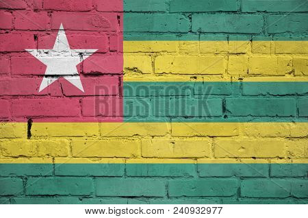 Togo Flag Is Painted Onto An Old Brick Wall