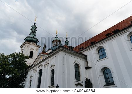 Strahov Monastery In Prague Against Cloudy Sky. Low Angle View