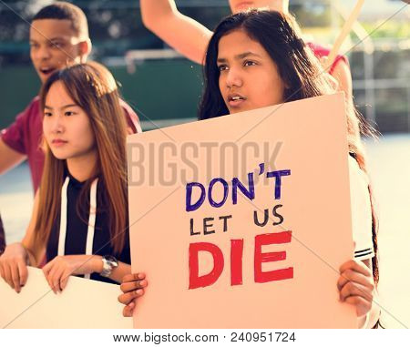 Group of teenagers protesting holding posters saying don't let us die antiwar justice peace concept