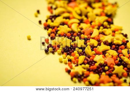 Colorful Nonpareil On Yellow Background. Selective Focus