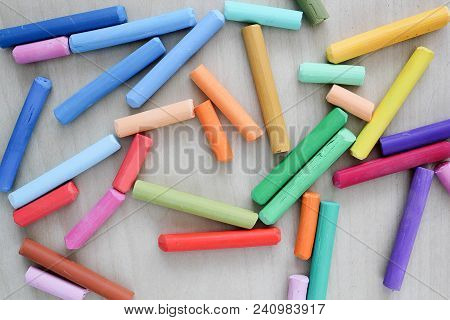 Pastel Crayons On Woden Table. Artist Suply