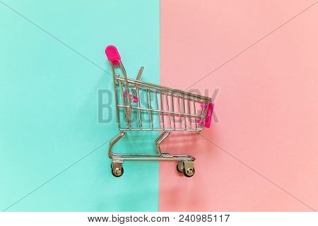 Small Supermarket Grocery Push Cart For Shopping Toy With Wheels And Pink Plastic Elements On Pink A